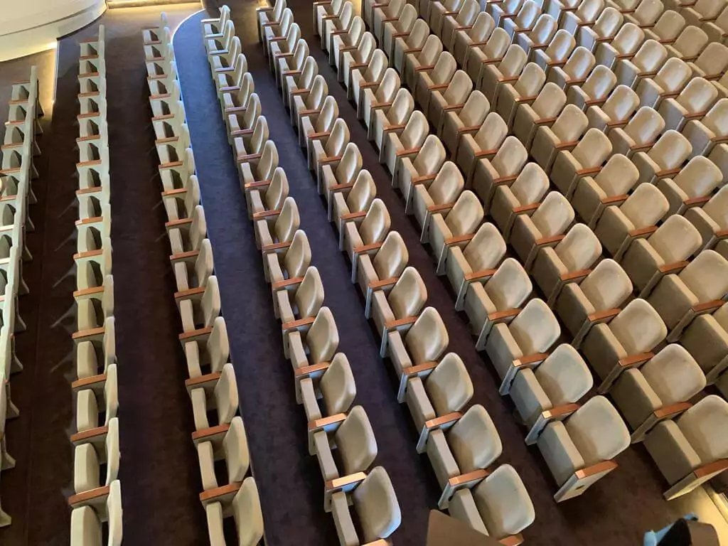 Premium auditorium seats installed in this theatre provide a perfect blend of comfort and modern design. Image